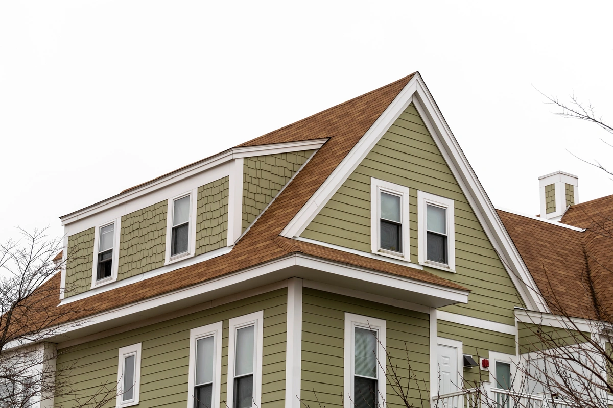 green siding on a house